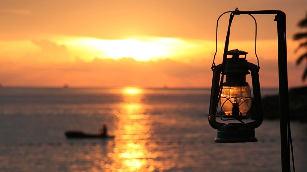 black and gray cable car over the sea during sunset