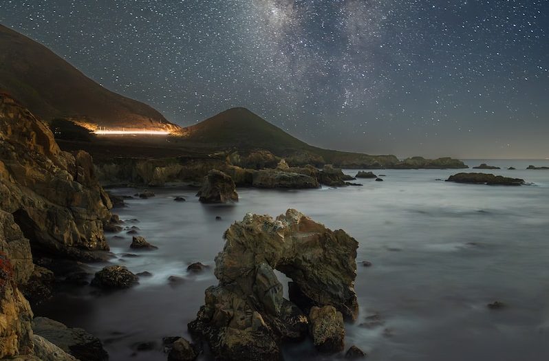 the night sky over a body of water