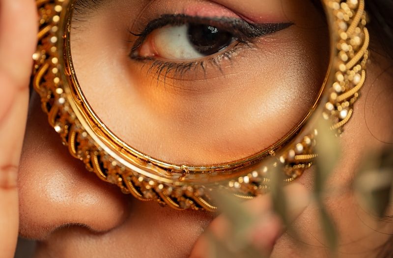 a woman looking through a magnifying glass