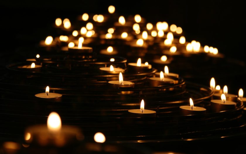 low-angle photo of lightened candles