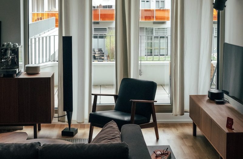 a living room filled with furniture and a flat screen tv