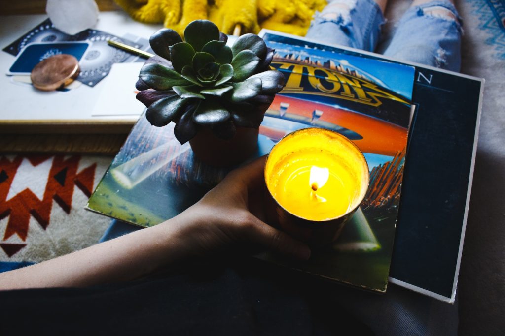 person holding tealight