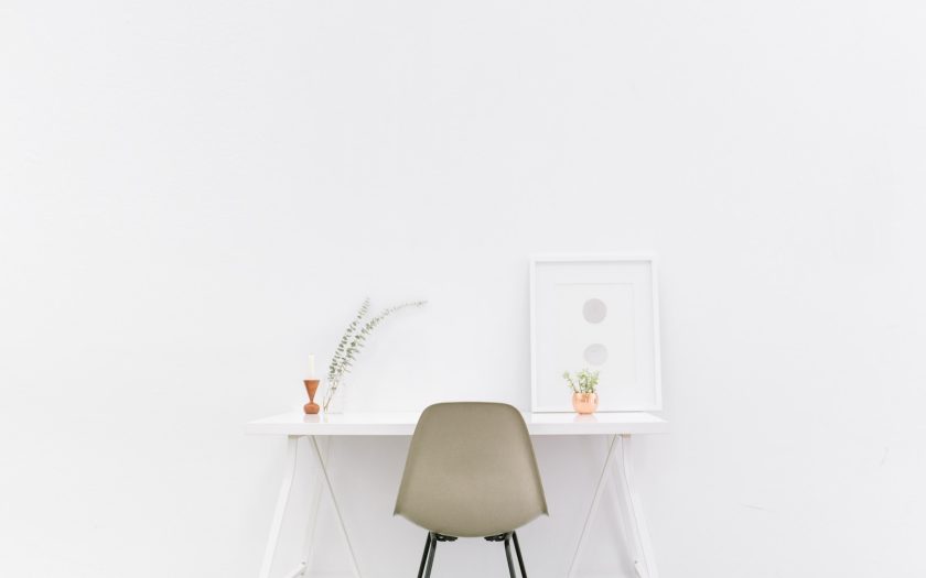 white wooden table near brown chair